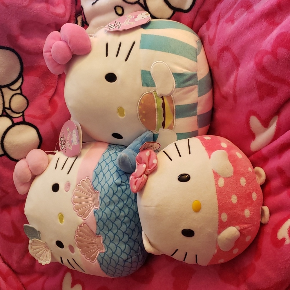 Three hello kitty plush